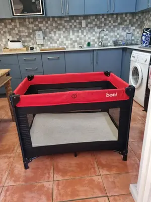 a black and red dog bed in a kitchen at Urban Oasis Cape Town in Cape Town