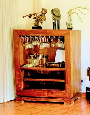 a wooden cabinet with a bar in a room at Regent Casa's - Cape Towns Blouberg Area - Where 20 people can stay in Cape Town