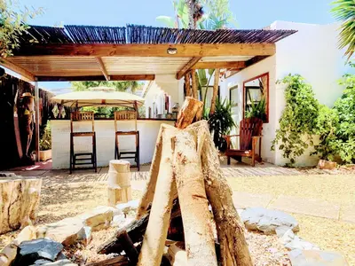 a piece of wood sitting in front of a house at Regent Casa's - Cape Towns Blouberg Area - Where 20 people can stay in Cape Town