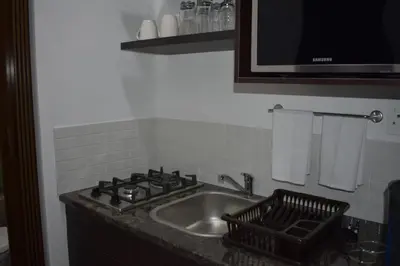 a kitchen counter with a sink and a stove at 105 on Sarel Cilliers in Strand