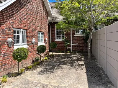 a brick house with a tree in the driveway at Somerset West All Stay 2 in Somerset West