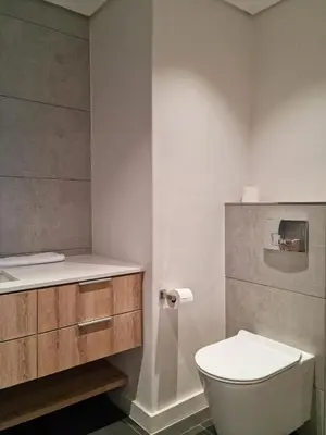 a bathroom with a toilet and a sink at Matrix by Smart City Stays in Cape Town