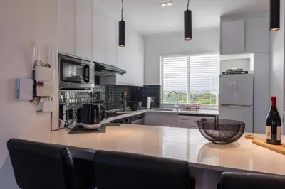 a kitchen with a counter with a bowl on it at Whale Rock 25 in Hermanus