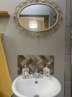a bathroom with a sink and a mirror at Mia Amore in Caledon