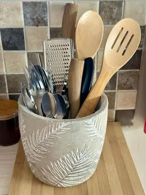 a metal bowl filled with utensils on a counter at Mia Amore in Caledon