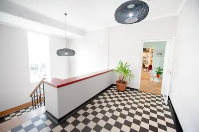 a hallway with a black and white checkered floor at Boho Chic Apartment Stellenbosch in Stellenbosch