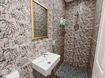 a bathroom with a sink and a mirror at Charm Nest - Uncapped Wi-fi & Self Check-in in Cape Town