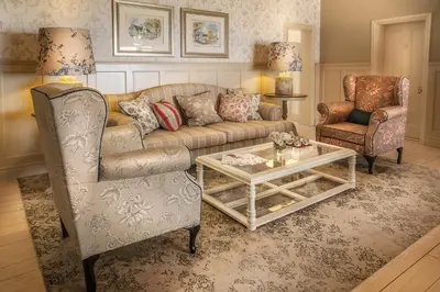 a living room with a couch and a coffee table at Avenues Guest House in Stellenbosch