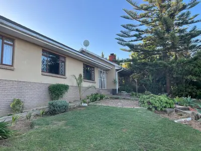 a house with a yard in front of it at The Charming Place in Cape Town