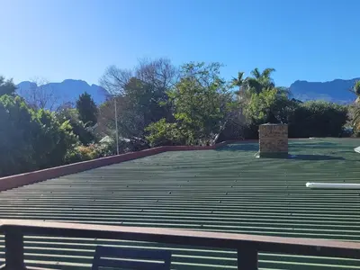 a roof with a fireplace on top of it at Elegantie Apartment Protea 5 Lovell Avenue in Stellenbosch