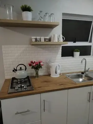 a kitchen counter with a tea kettle and a sink at Harmonie Self Catering in Wolseley