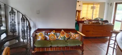 a living room with a couch with pillows at The 10th Hole - Golf Estate in Villiersdorp