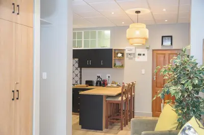 a kitchen with a table and a dining room at Royal Pearl, Insta-worthy APT in Paarl