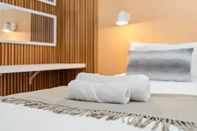 two towels sitting on top of a bed at Mayfair Luxury 212 by Host Agents in Cape Town