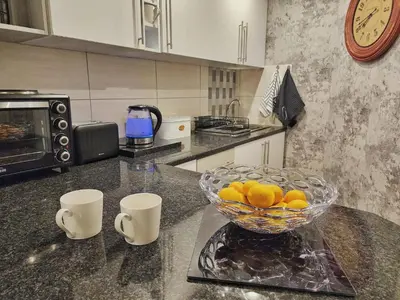 a kitchen with a bowl of lemons on a counter at 10 on Gillian Self-catering Apartments - NOT AFFECTED BY LOADSHEDDING in Eversdal