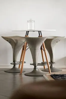 a table and chairs with a glass on top of it at Rondebosch Central in Cape Town