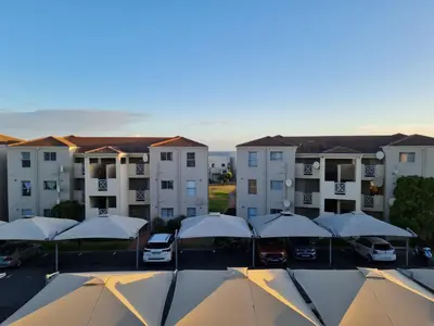 an aerial view of a parking lot with buildings at Hermanus Beach Club UNIT 74 in Hermanus