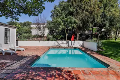 a swimming pool in the backyard of a house at Twistniet BnB in Wellington