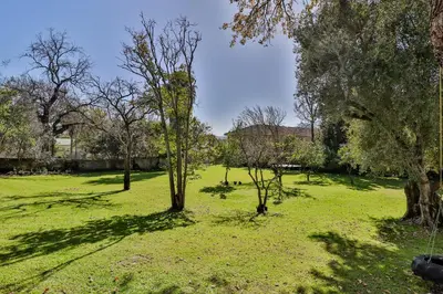a green field with trees and green grass at Twistniet BnB in Wellington