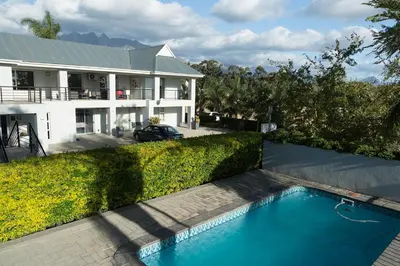 an aerial view of a house with a swimming pool at Monte Vidéo Guesthouse in Wellington