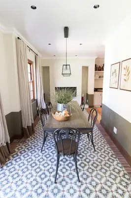 a dining room with a table and chairs at La Clé Village in Franschhoek