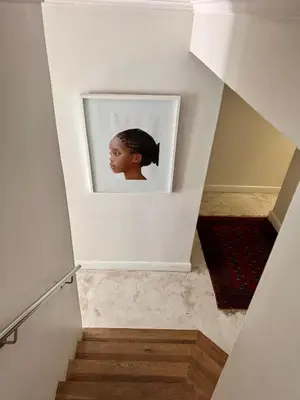a stairwell with a picture of a woman at Tuishuisie in Stellenbosch