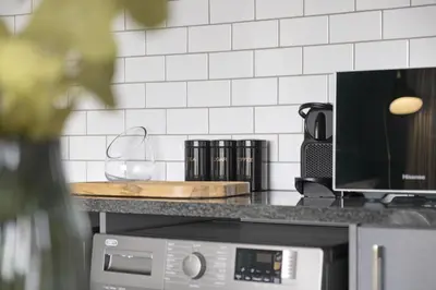 a kitchen with a counter top with a microwave at The Terraces 330 by Host Agents in Cape Town