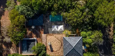 an overhead view of a house with a tree at Two Bedroom Soutpan Apartment in Hermanus
