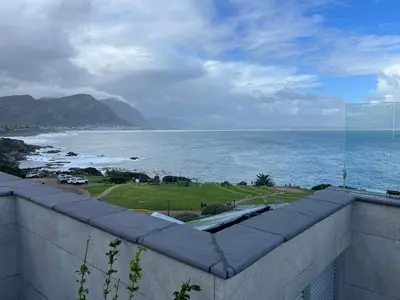 a view of the ocean from a balcony at Hermanus Waterfront Apartment no 17 in Hermanus