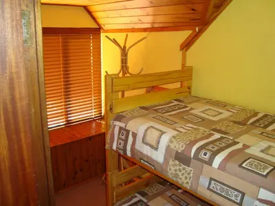 a bedroom with a bed in a room at Pentzhaven Guesthouse in Table View