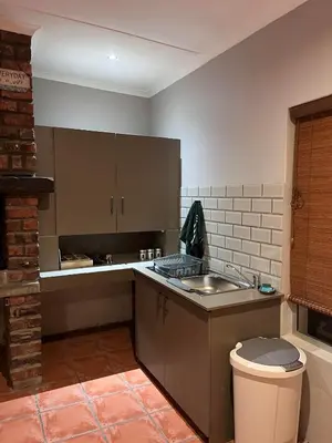 a kitchen with a sink and a counter top at Olive Tree in Worcester
