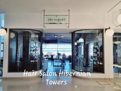 a store with glass windows in a building at Beachfront Luxury Apartment - Hibernian Towers 309 Strand - Self Catering in Cape Town