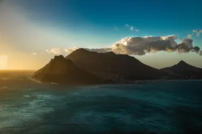 a view of the ocean with a mountain at Serenity Shores Backpackers in Cape Town