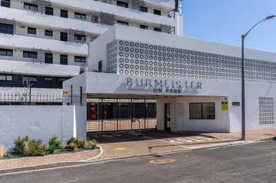 a building with a sign that reads burniates her on max at Burmeister 606 - Top Floor 2 Bedroom Apartment with Ocean Views - Onsite Parking in Cape Town
