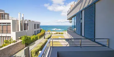 a balcony with a view of the ocean at Harbour House Hotel - Le Paradis Apartments in Hermanus