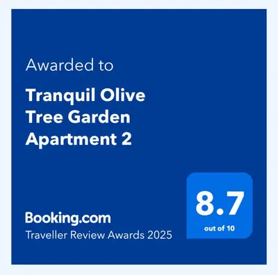 a blue sign that says thankful alive tree garden agreement at Tranquil Olive Tree Garden Apartment 2 in Cape Town