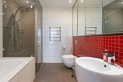 a bathroom with a sink and a toilet and a shower at Grand Penthouse / Backup Power / Stunning in Cape Town