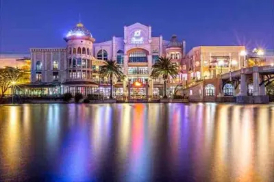 a large building with palm trees in front of it at Grand Penthouse / Backup Power / Stunning in Cape Town