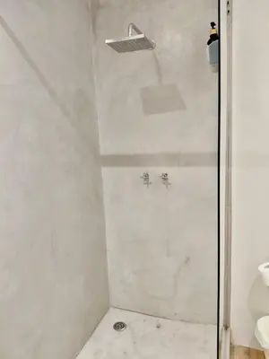 a shower with a glass door in a bathroom at Pepper Korrel - Paarl - Self Catering Apartment in Paarl