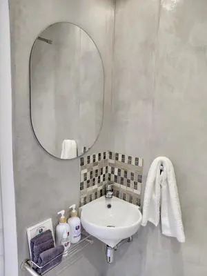 a bathroom with a sink and a mirror at Pepper Korrel - Paarl - Self Catering Apartment in Paarl