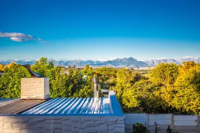 a view of the mountains from the roof of a house at Villa Luisa: Sun-filled hidden gem with Pool. in Cape Town