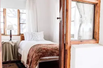 a bedroom with a bed and a window at La Bri Guesthouse in Rawsonville