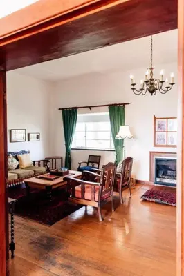 a living room with a couch and a table at La Bri Guesthouse in Rawsonville