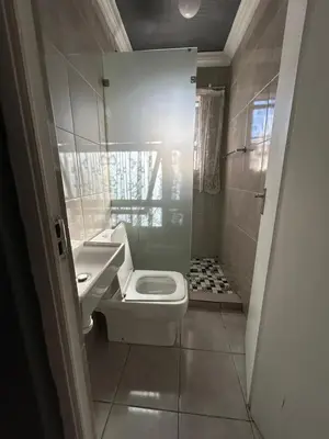 a small bathroom with a toilet and a sink at 57onWYNNE in Cape Town