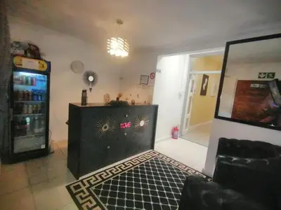 a living room with a soda machine and a couch at 57onWYNNE in Cape Town