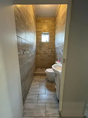 a bathroom with a toilet and a sink at 57onWYNNE in Cape Town