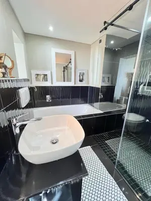a bathroom with a sink and a shower at Portico 705 in Cape Town