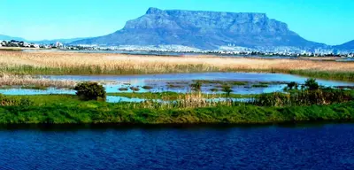 a mountain in the distance with a body of water at Casa Mia Guesthouse in Table View