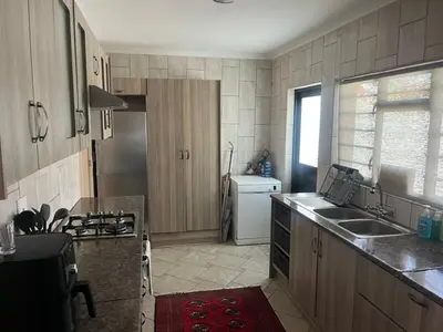 a kitchen with a sink and a counter top at The Elephant Cottage in Cape Town