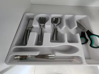 a white tray with silver utensils in it at Wagenaar Villas in Monte Vista